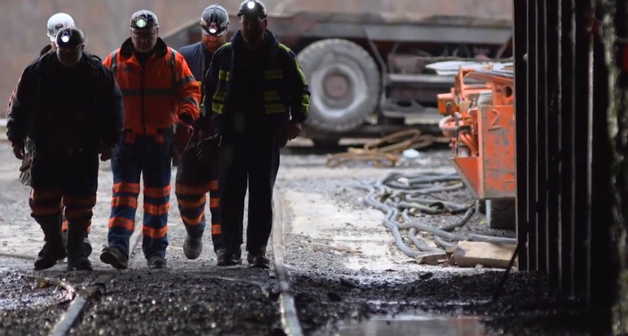 Coal miners walking toward the mine entrance