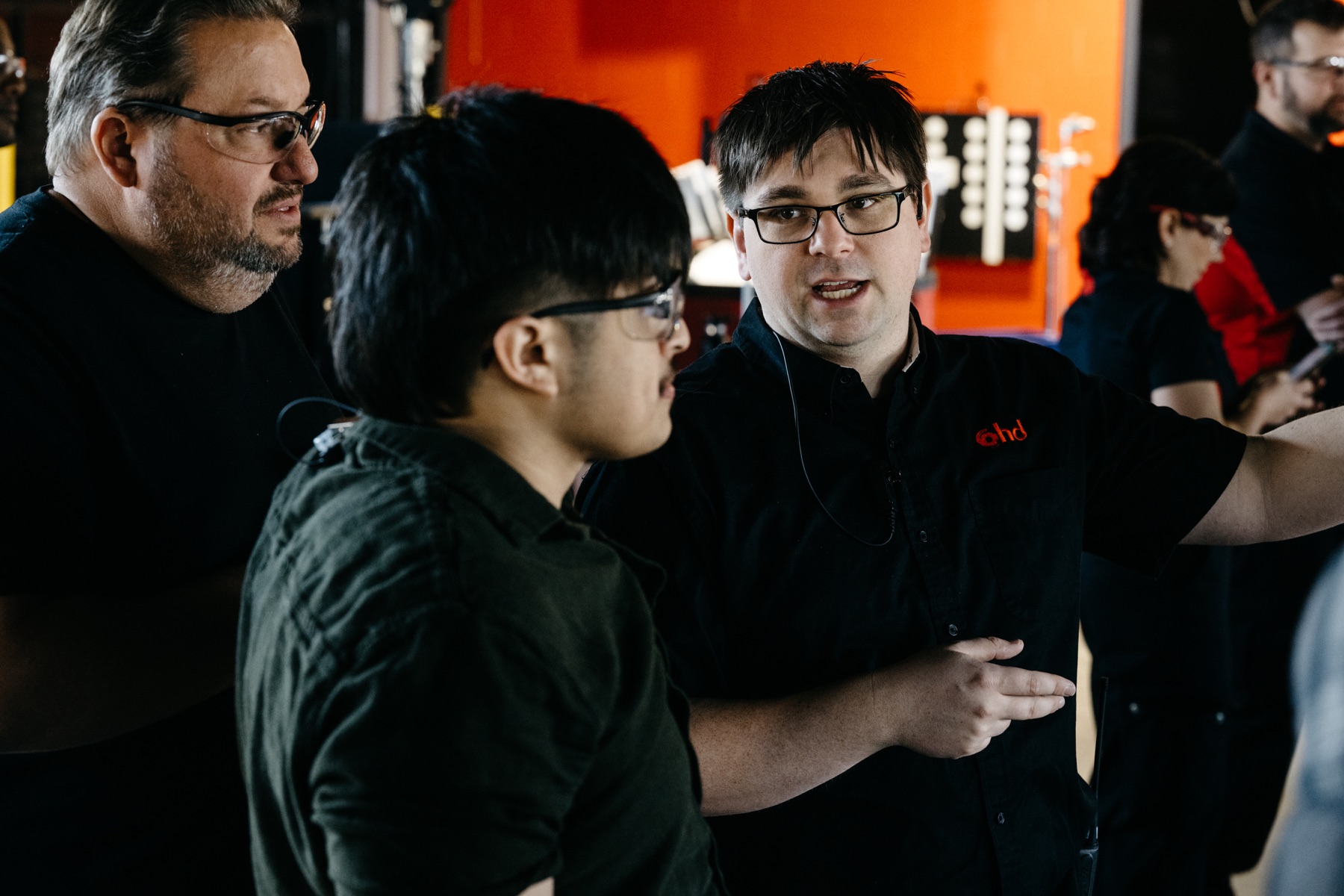 Production team discussing a camera setup on location